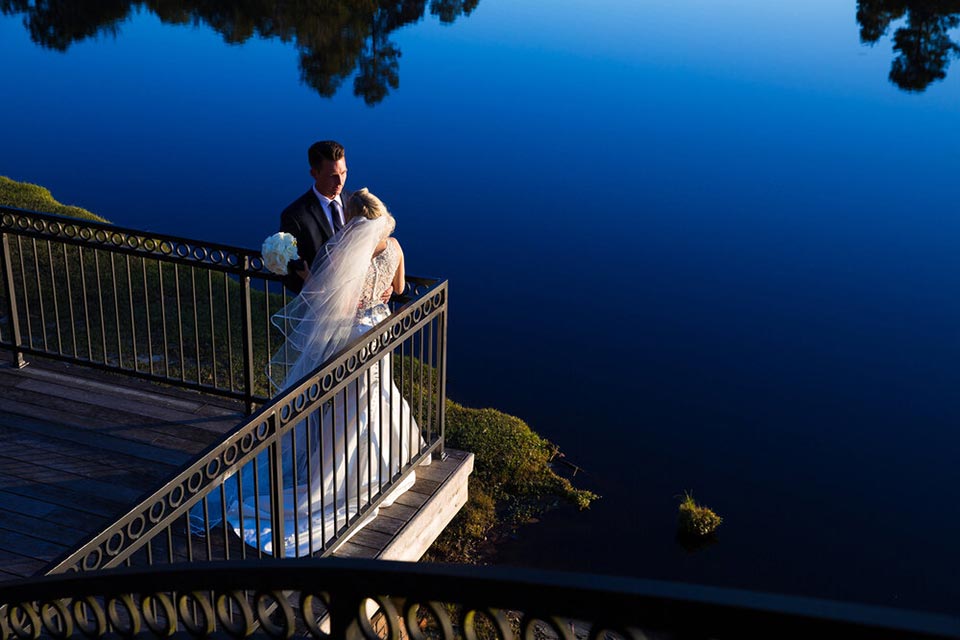 Photo of bride and groom on balcony after just being married