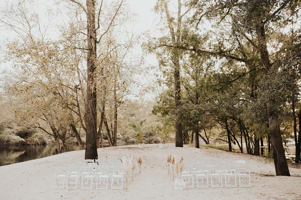Photo of river Lodge grounds with chairs for a wedding