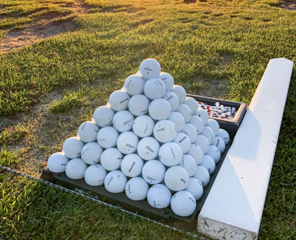 Photo of golf balls stacked into a pyramid