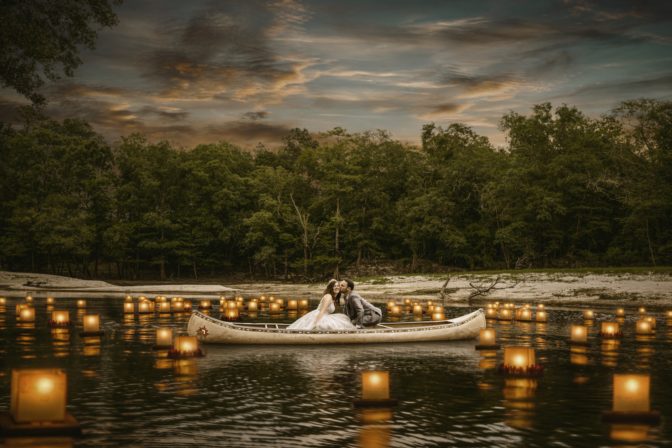 couple on river with lanterns on the river