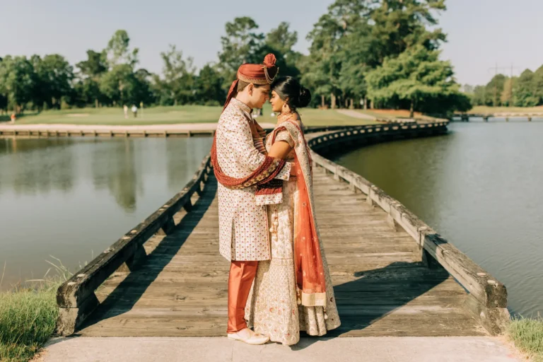 couple on bridge over the water
